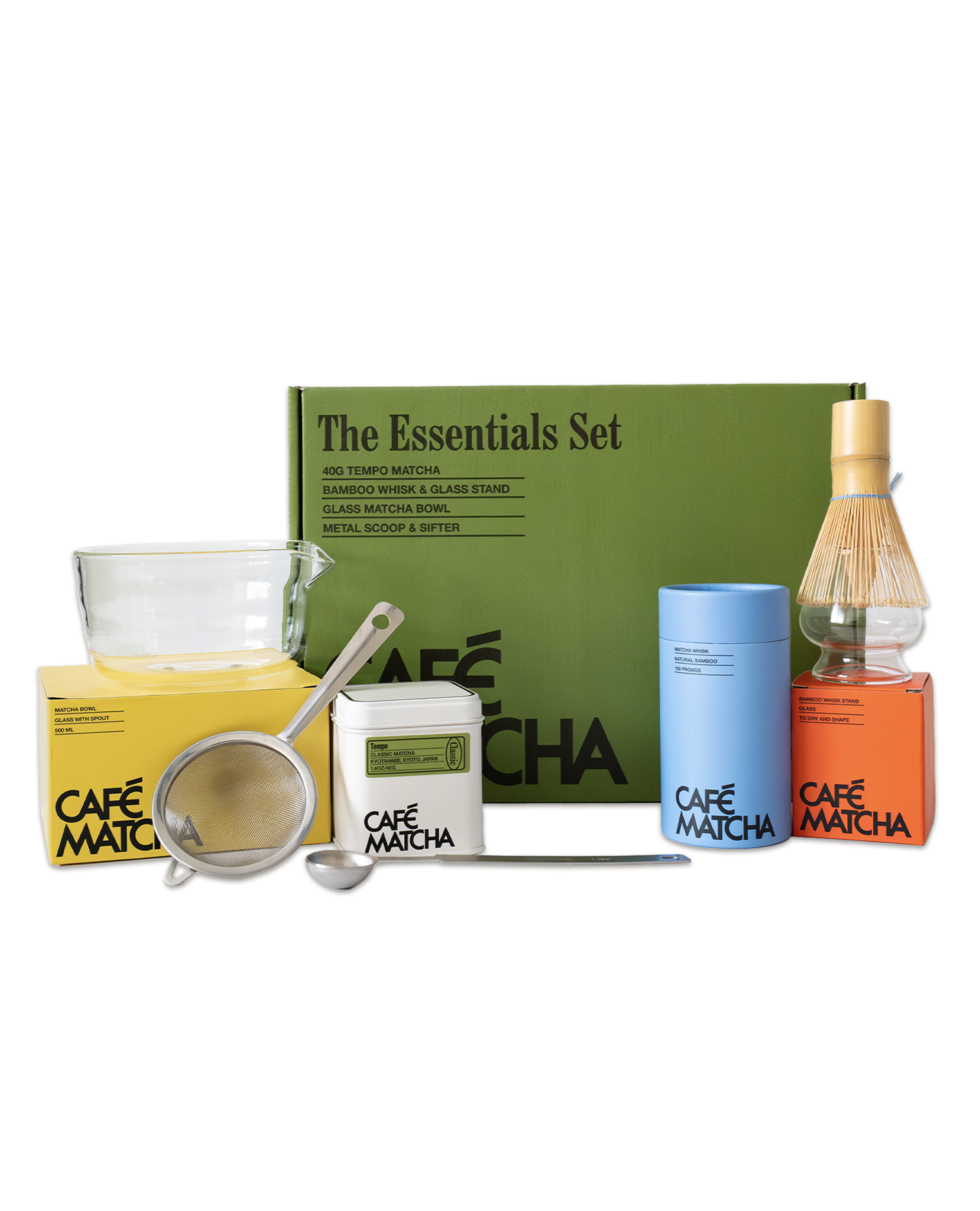 Café Matcha essentials set with green box, matcha bowl, whisk, and other items on a white background